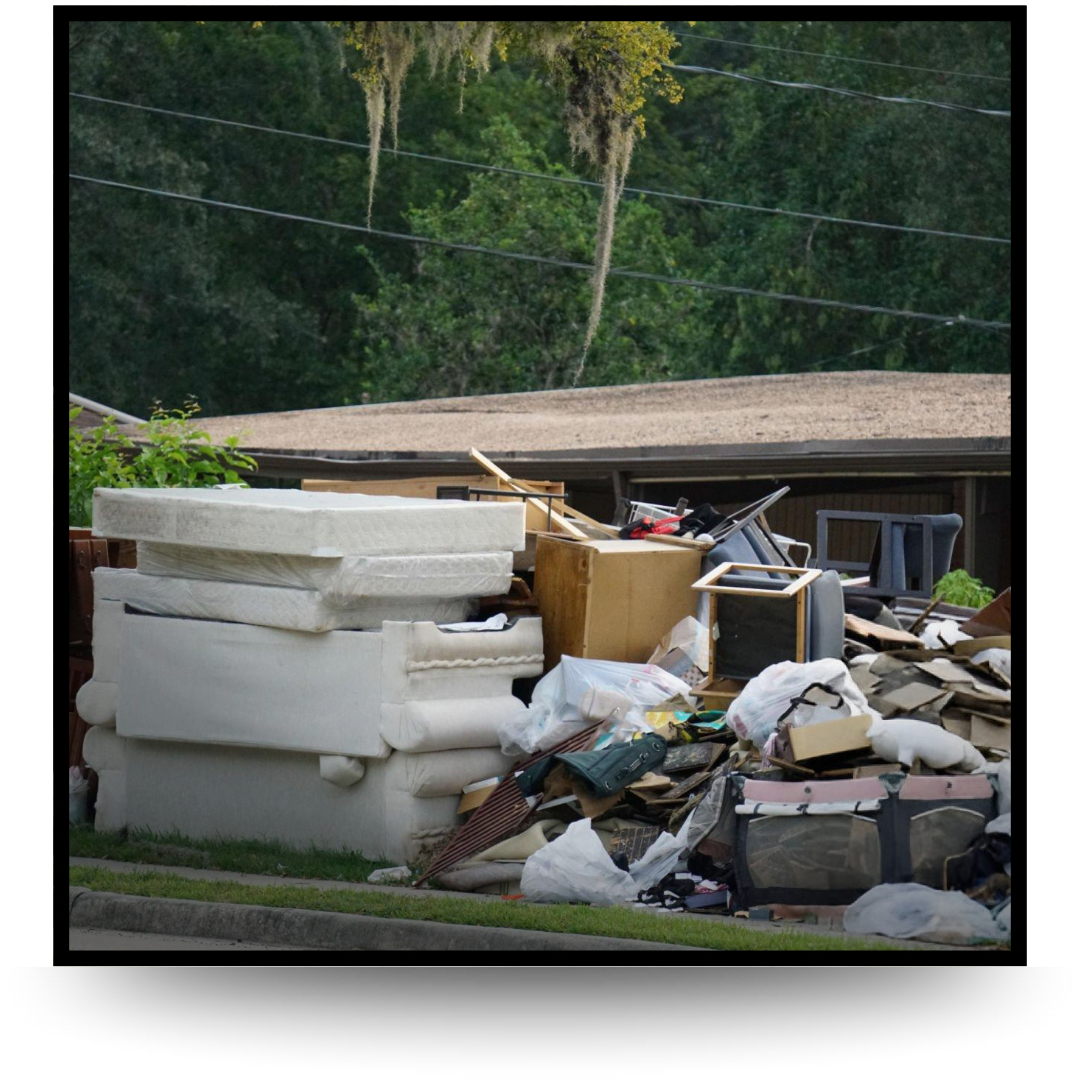 A pile of house garbage infront of house