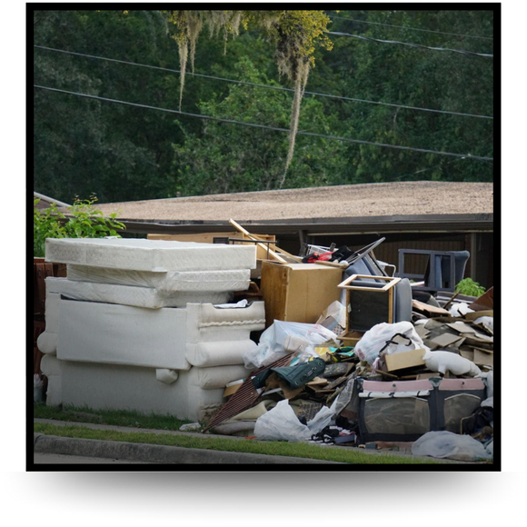 A pile of house garbage infront of house