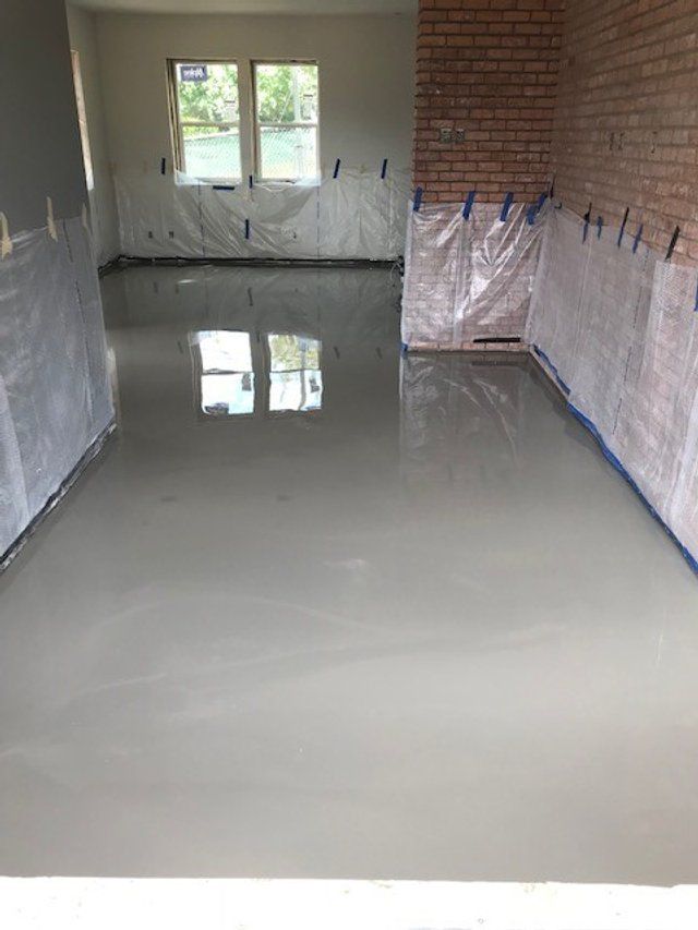 A room with a brick wall and a white floor.