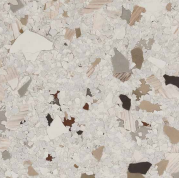 A close up of a white and brown granite counter top