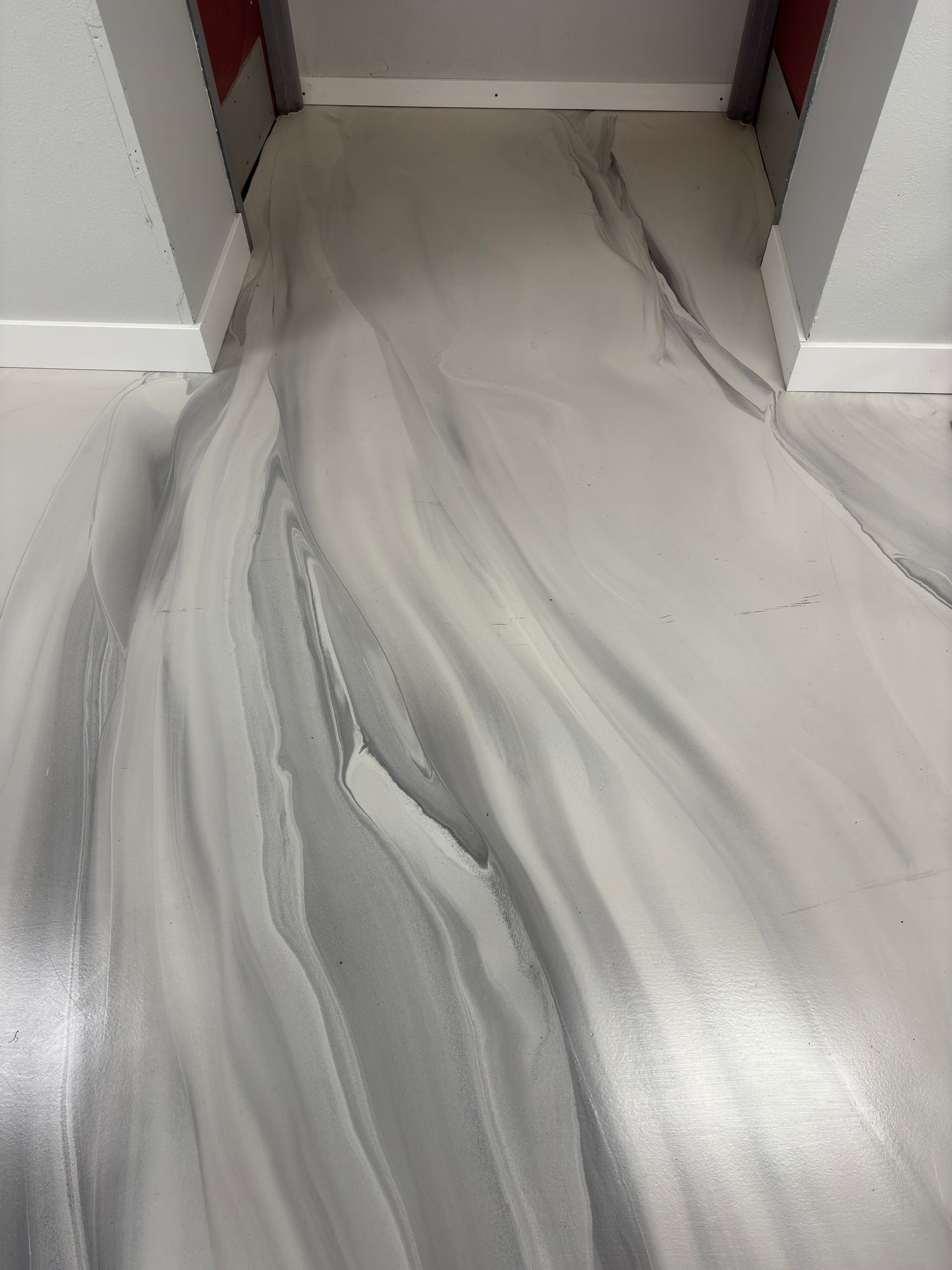 A close up of a marble floor in a room.