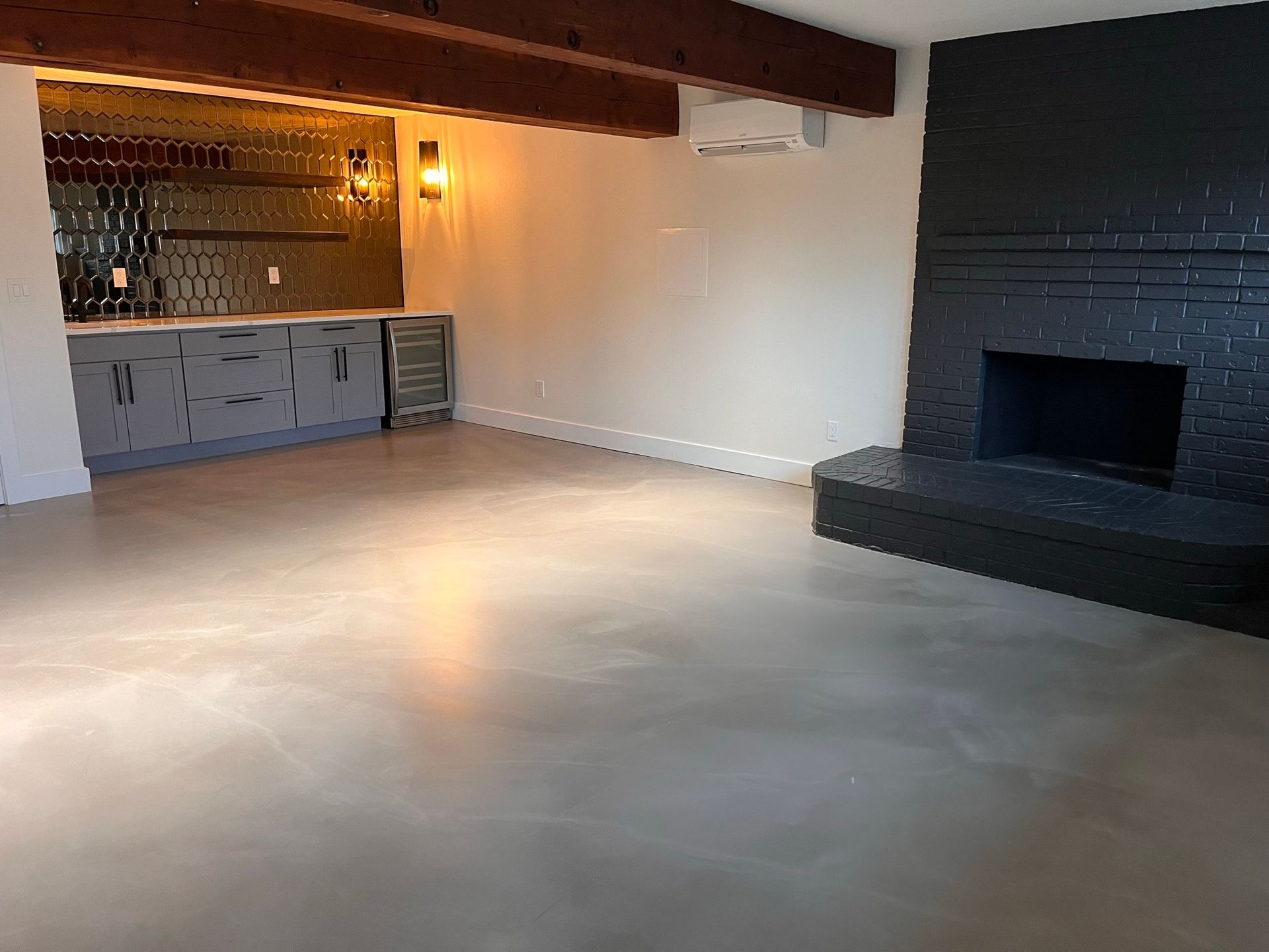 There is a fireplace in the middle of the room.