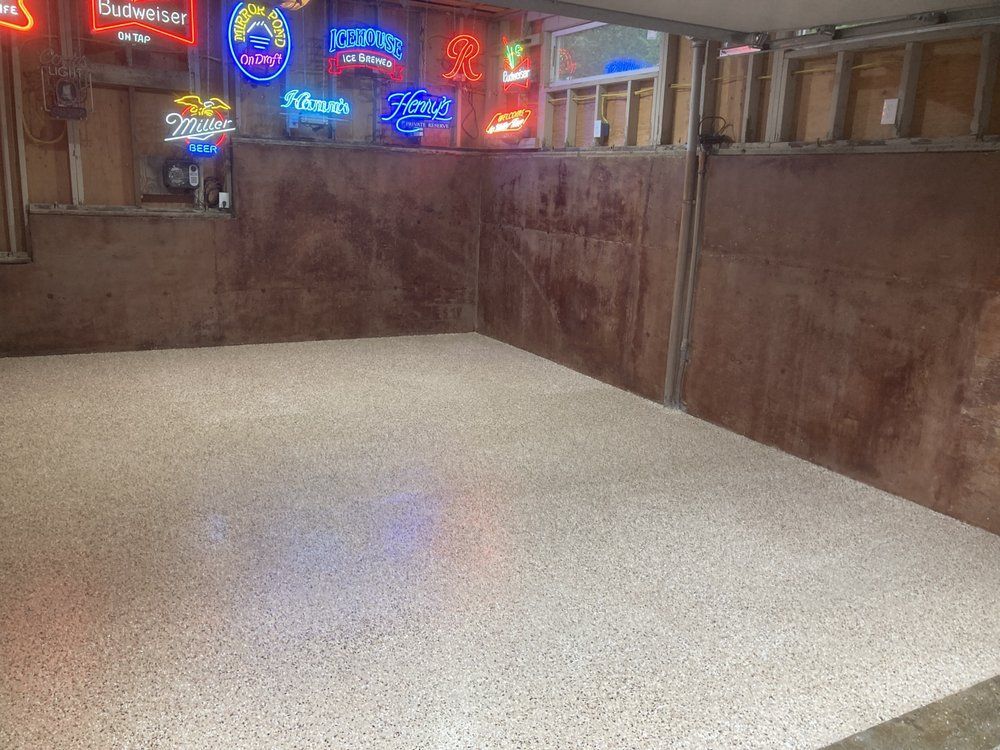 A room with a lot of neon signs on the wall.