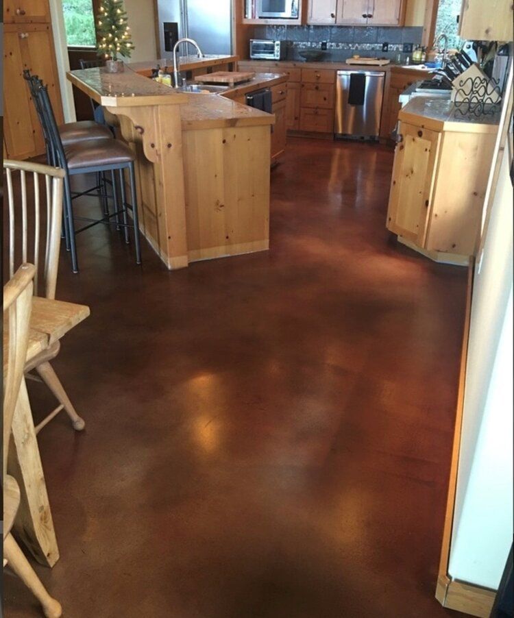 A kitchen with wooden cabinets and stainless steel appliances