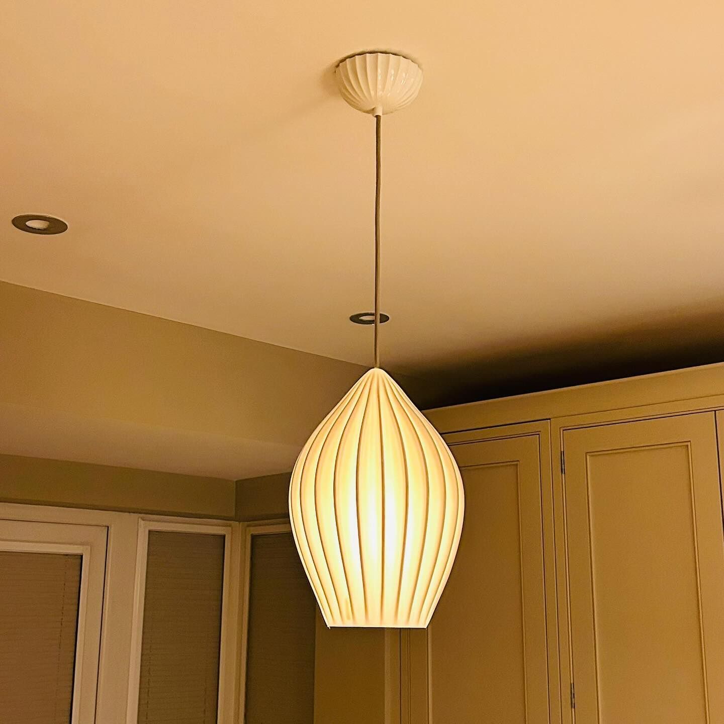 A light hanging from the ceiling in a kitchen