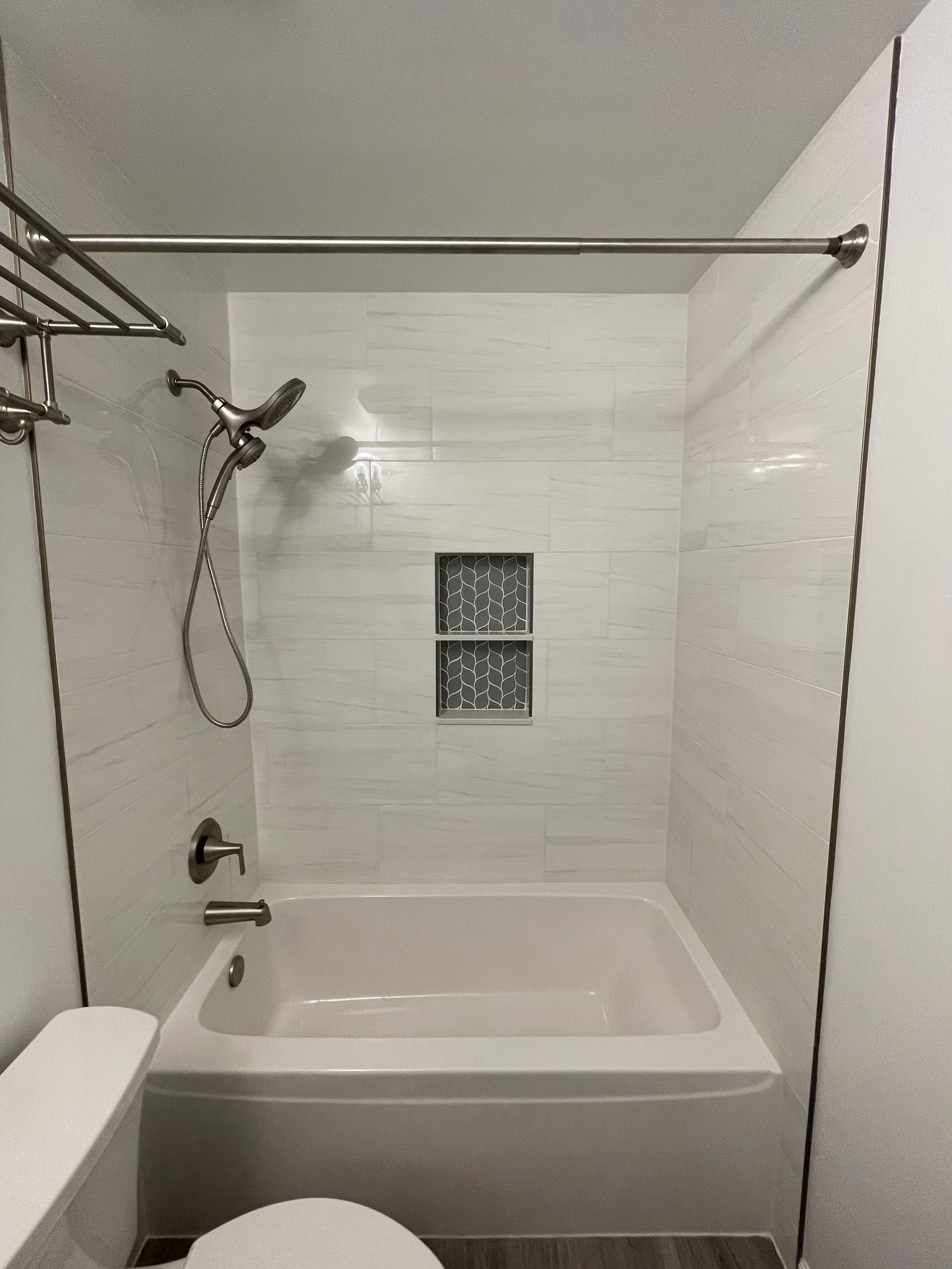 A Bathroom with A Bathtub , Toilet and Shower.