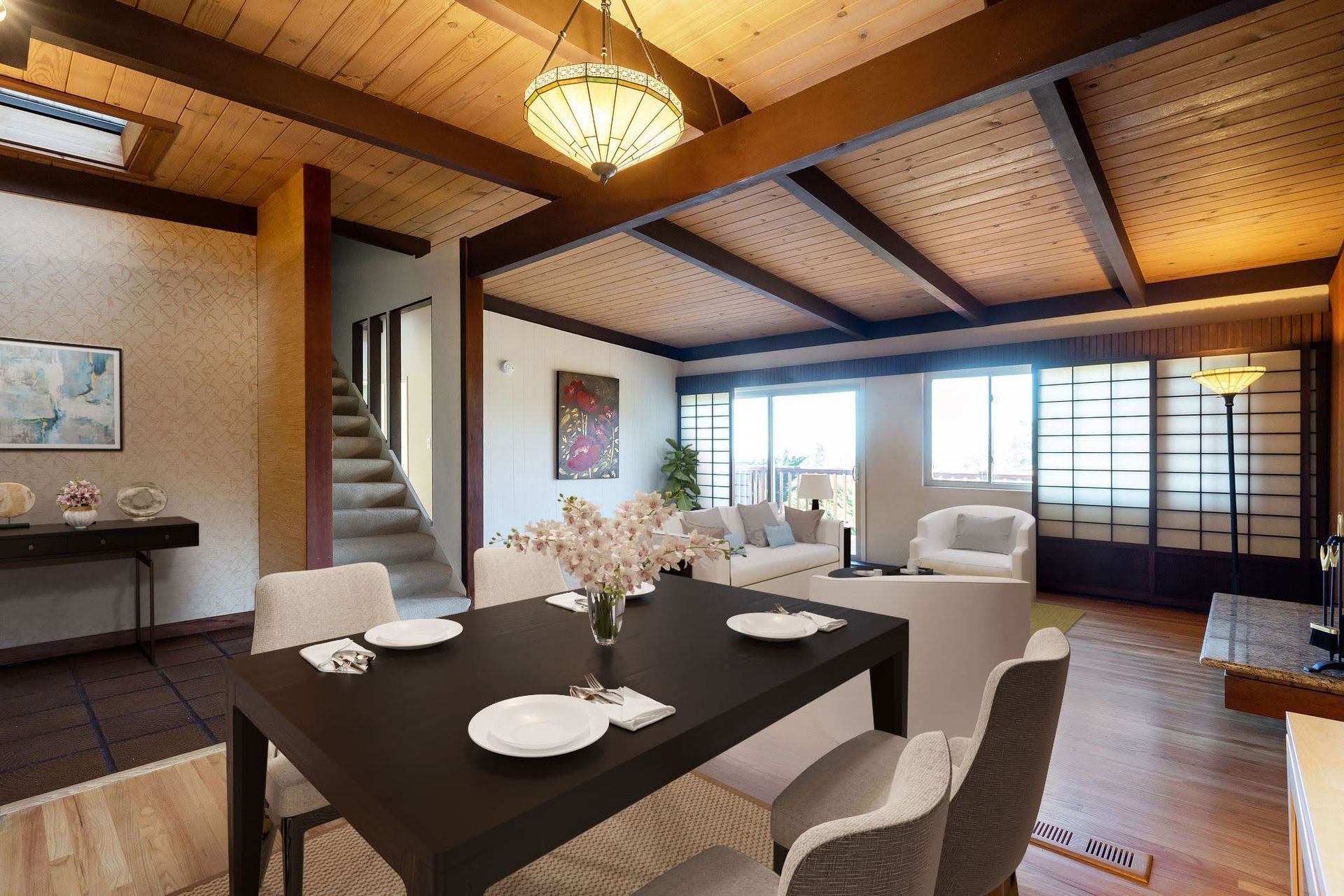 A living room with a dining table and chairs