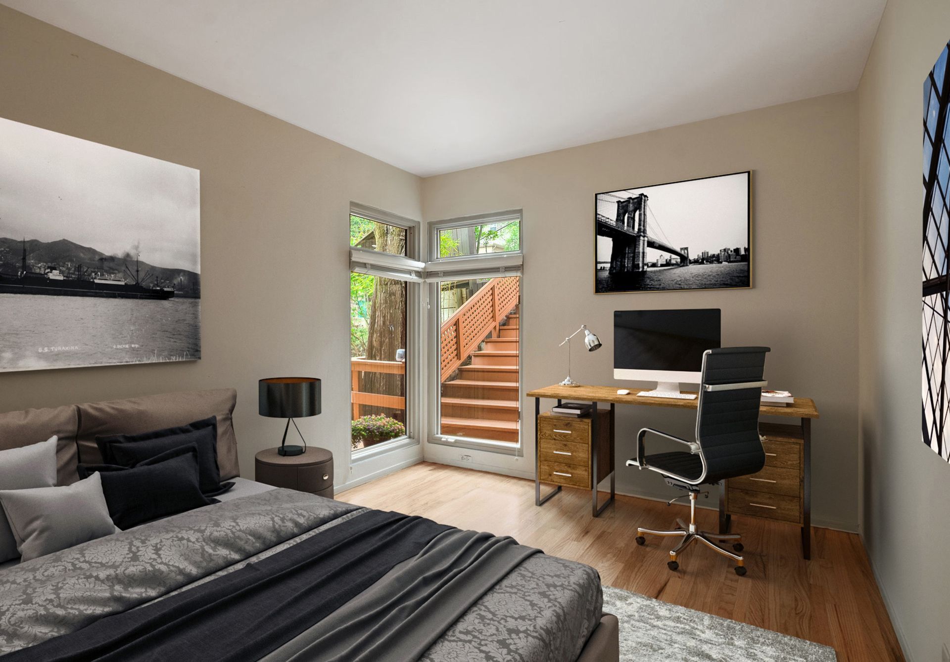 A bedroom with a large bed and a desk with a computer on it
