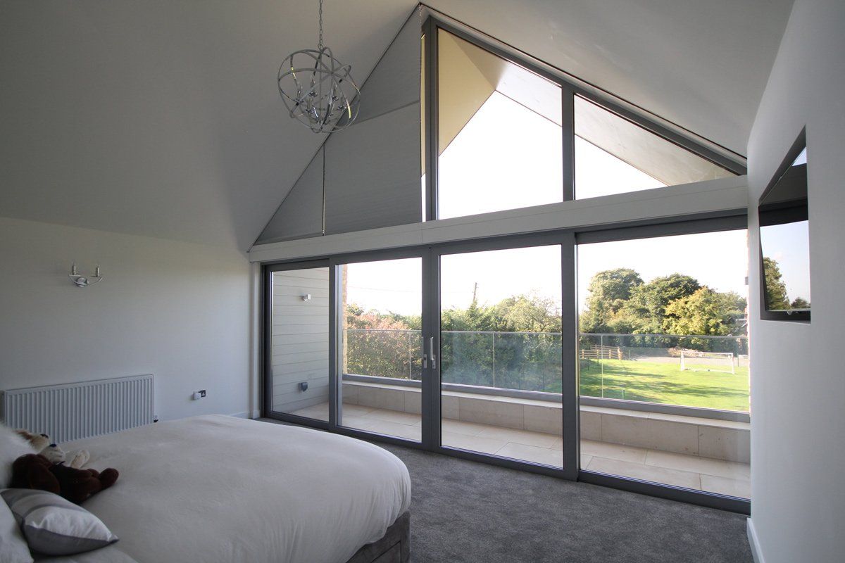 curved blinds for cured roof area near bedroom
