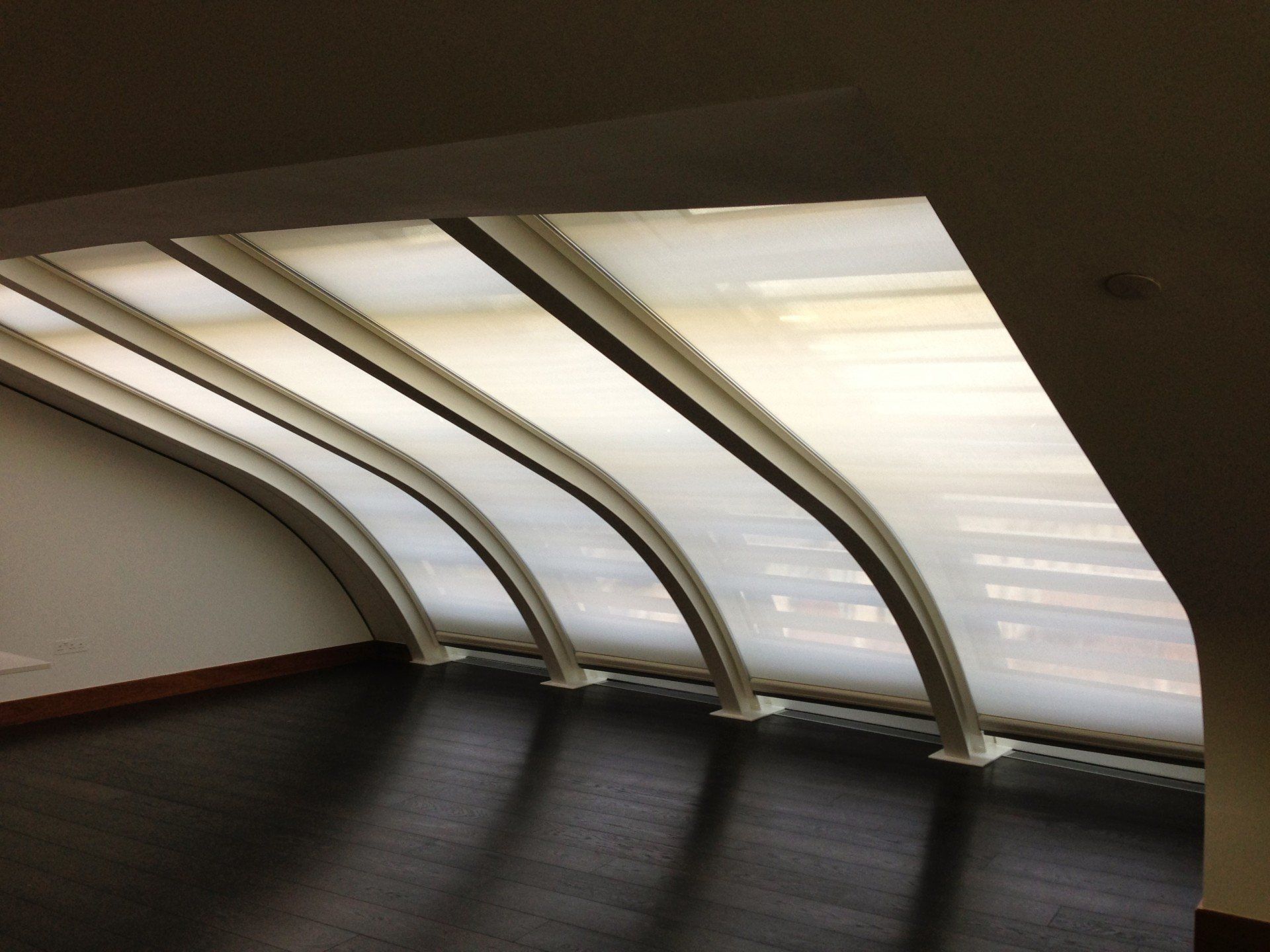 Blinds and shutters for a curvy window