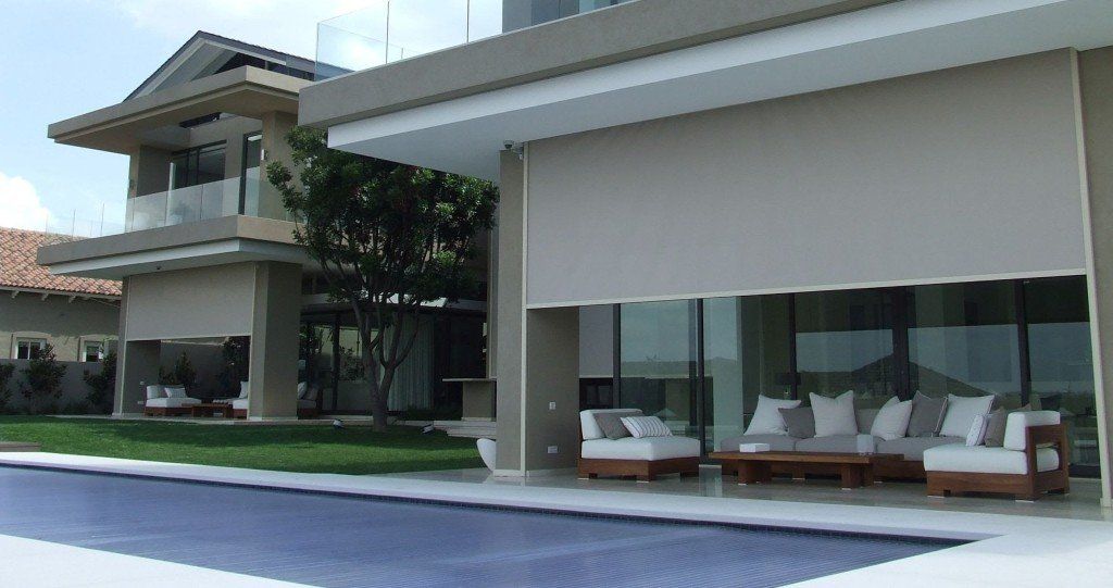 external blinds nearby outdoor seating area and swimming pool