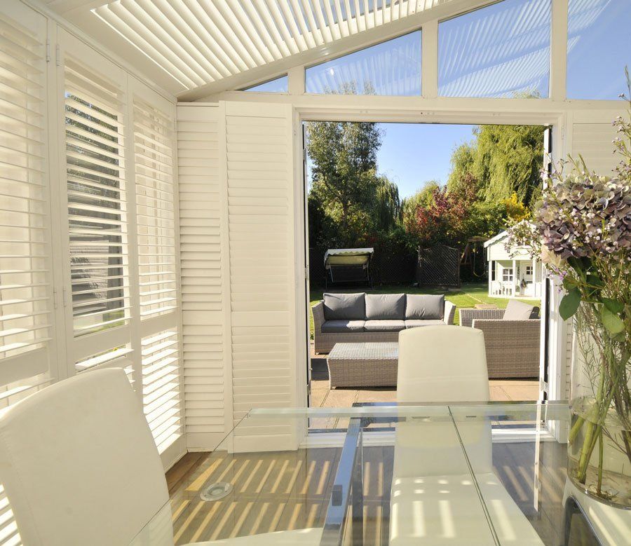 white blinds installed on a conservatory