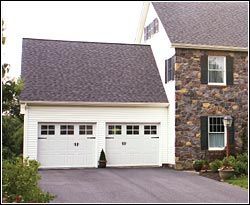 Beautiful White House With Garage Doors — Cumberland, RI — Woonsocket Door Sales