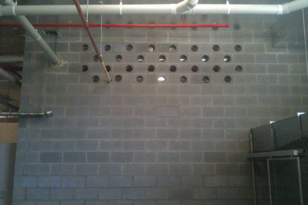 cinder block wall with cored holes