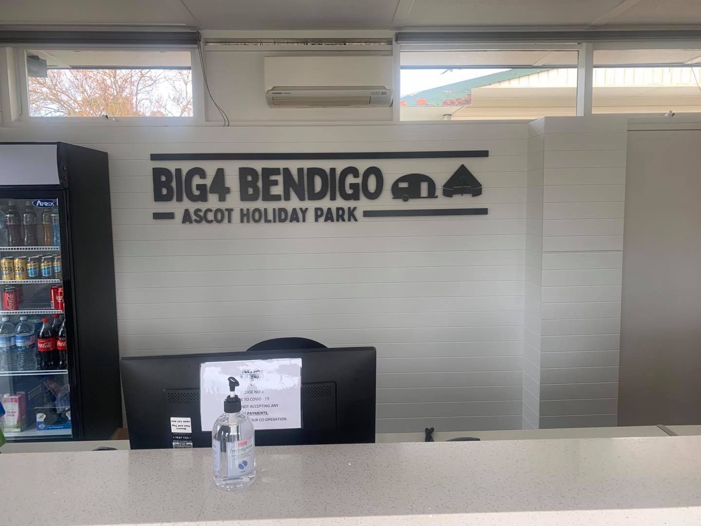 A restaurant with a sign on the wall that says big4 bendigo ascot holiday park.