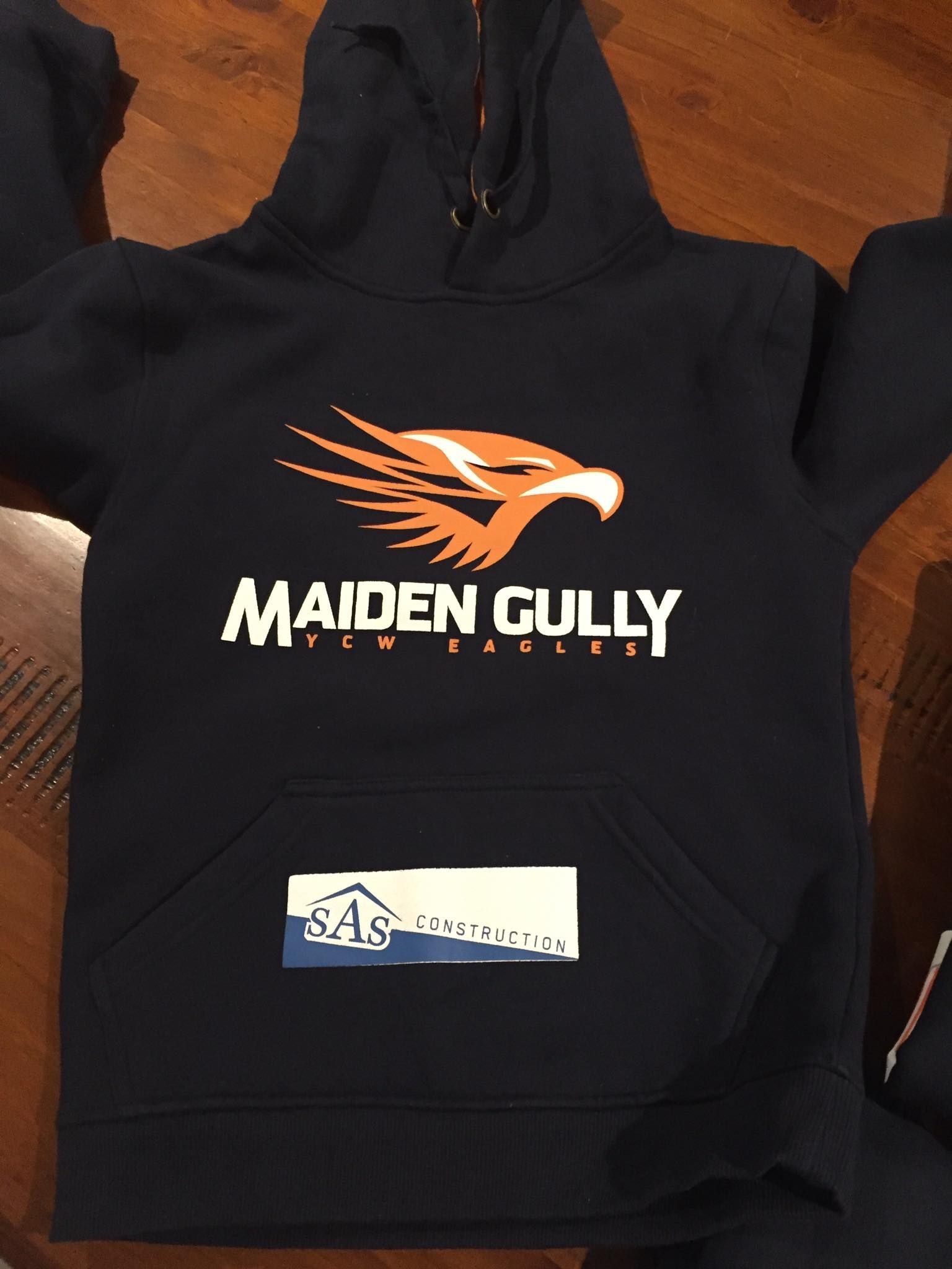 A black hoodie that says maiden gully on it