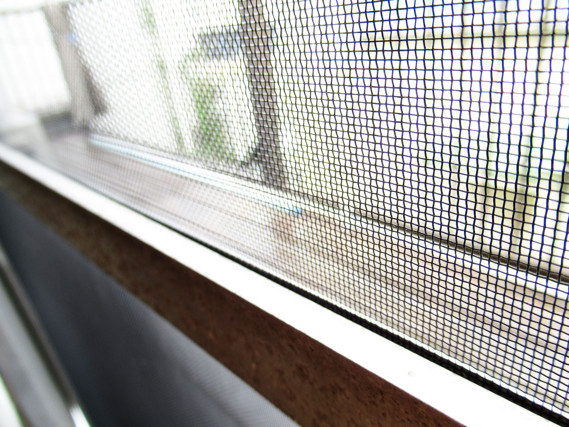 A close-up of a security screen window.