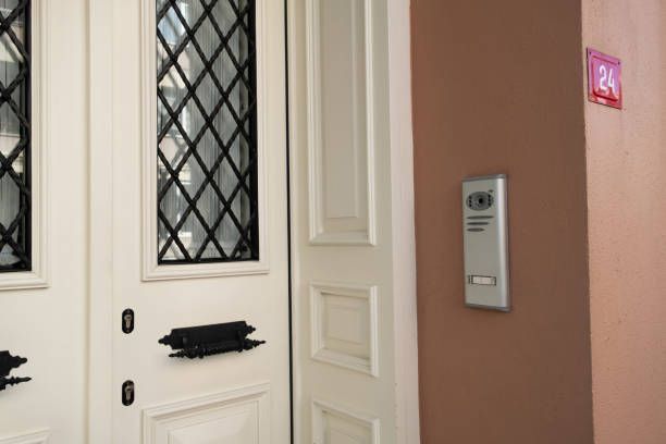 A white door with a black handle and a sign that says ' a ' on it