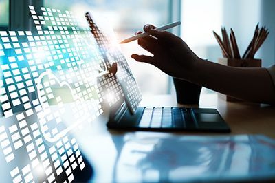 A person is using a tablet computer with a pen.