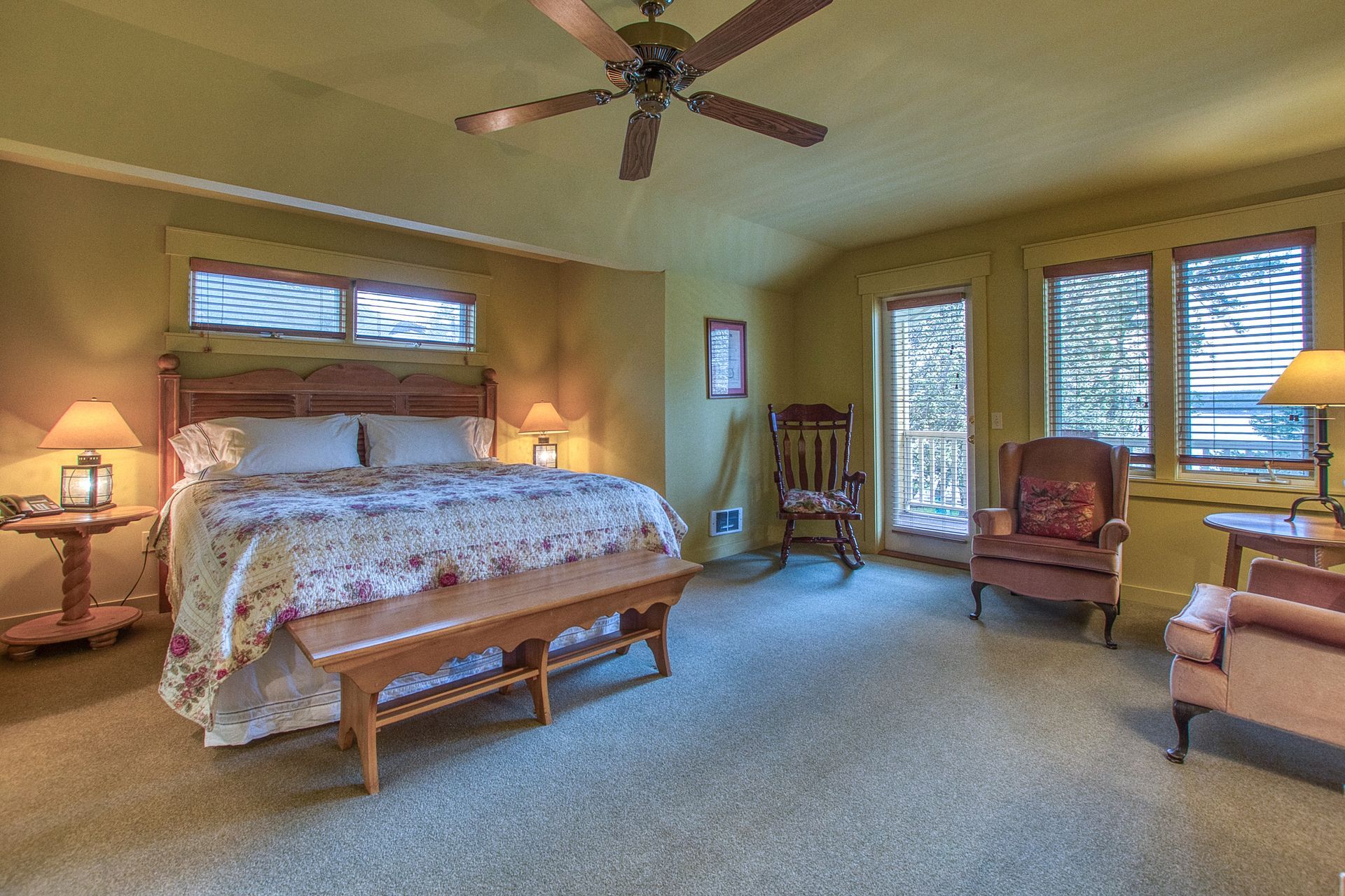 Two mirrors are hanging on a wall next to each other.