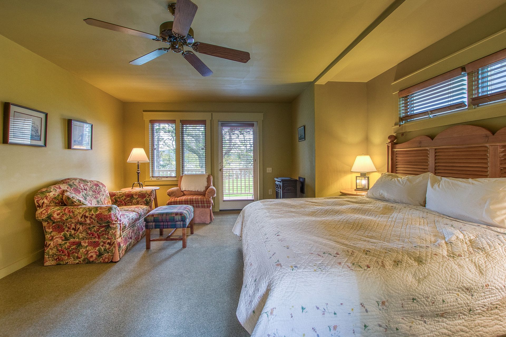 A bathroom with a sink , mirror , tub and shower.