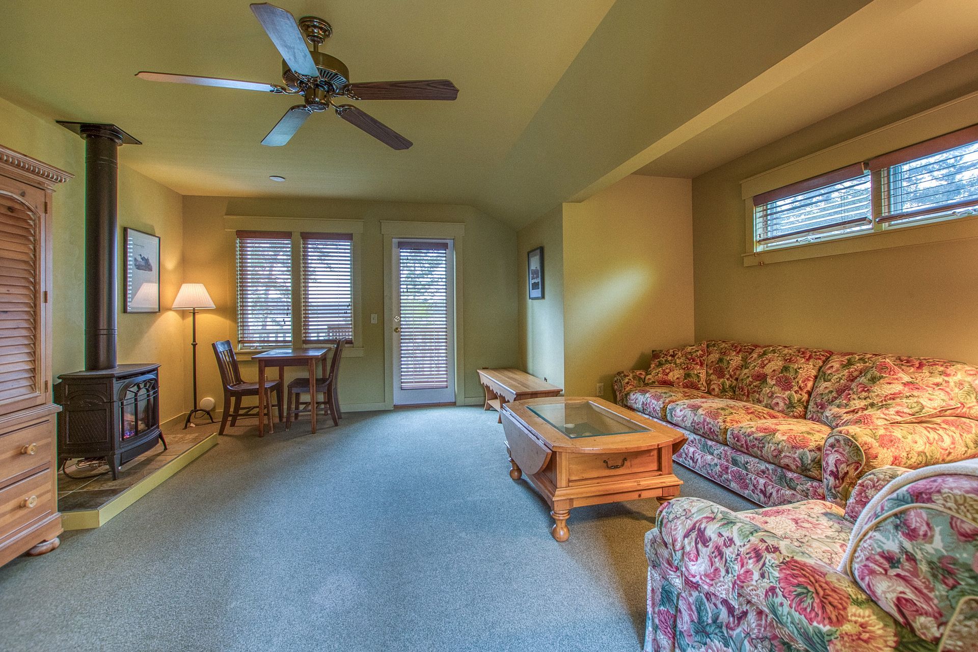 A living room with a fireplace and a couch