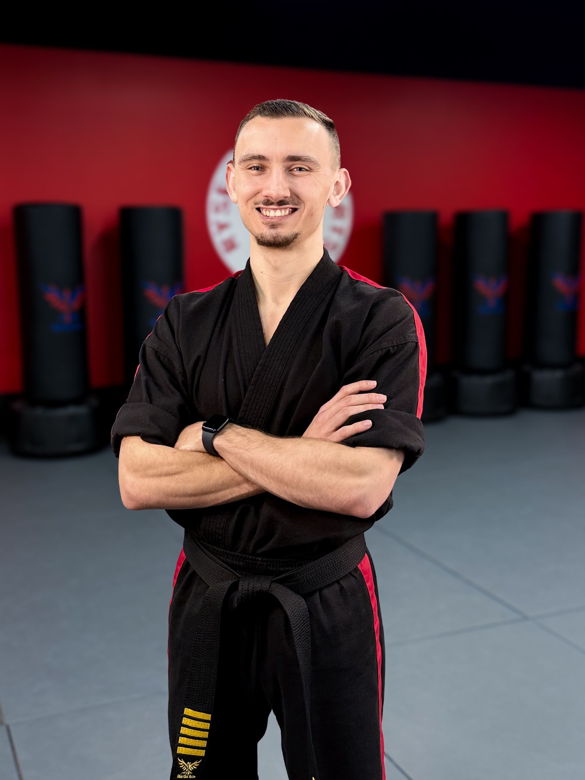 A man is sitting on the floor with a bottle of water