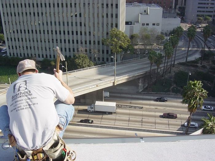 worker installing a gutter