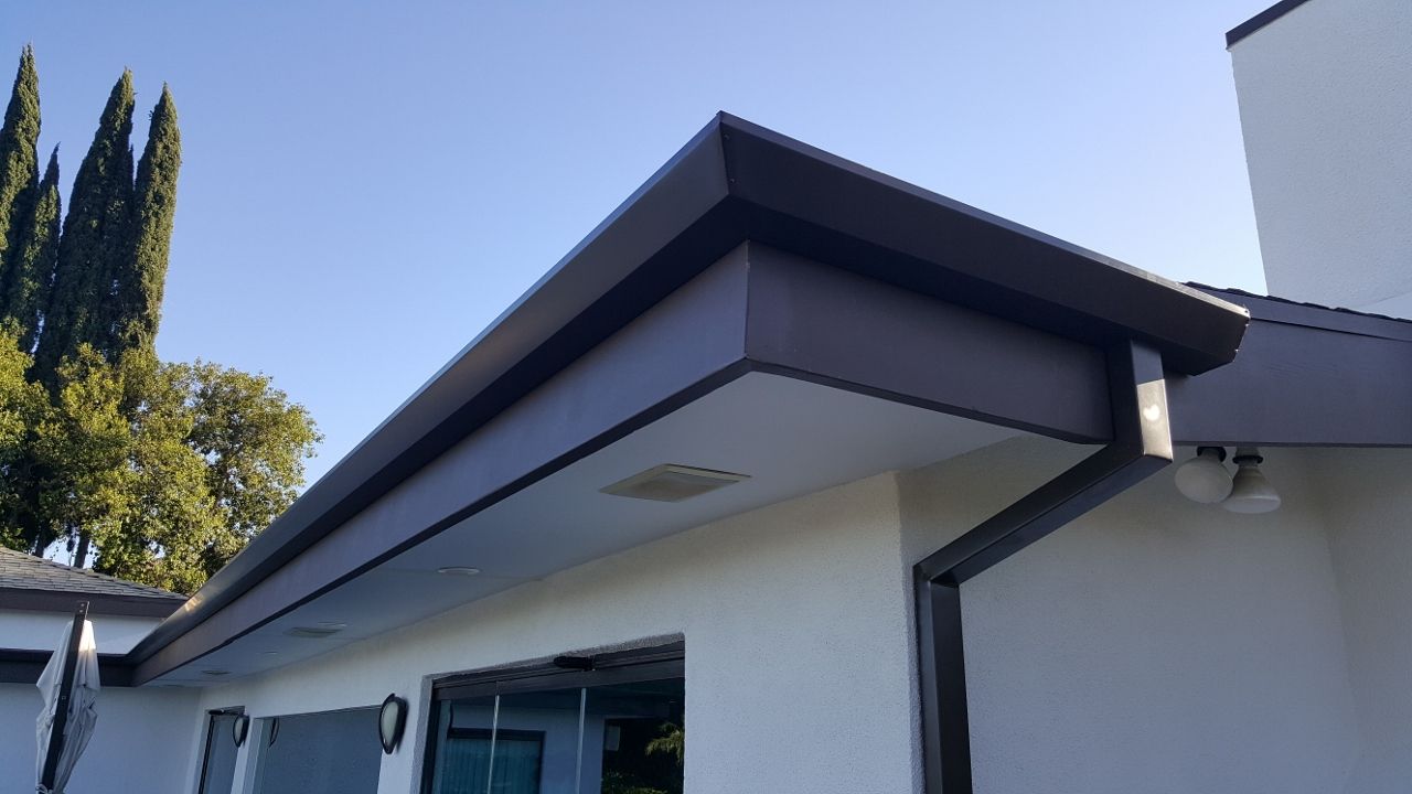 worker installing a gutter