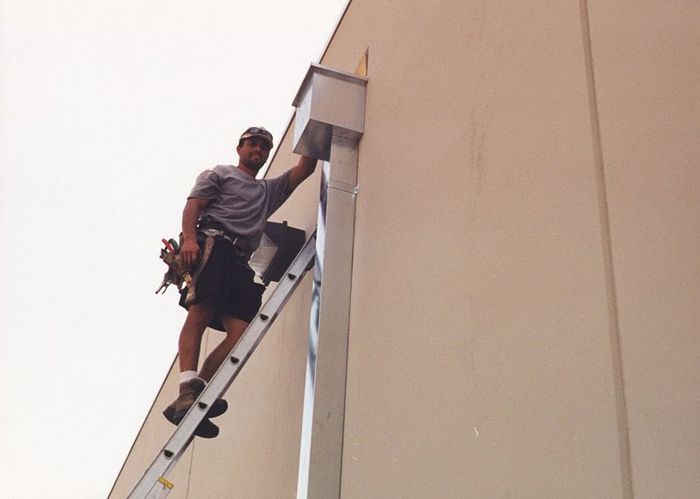 worker installing a gutter