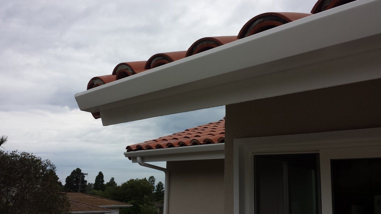 worker installing a gutter