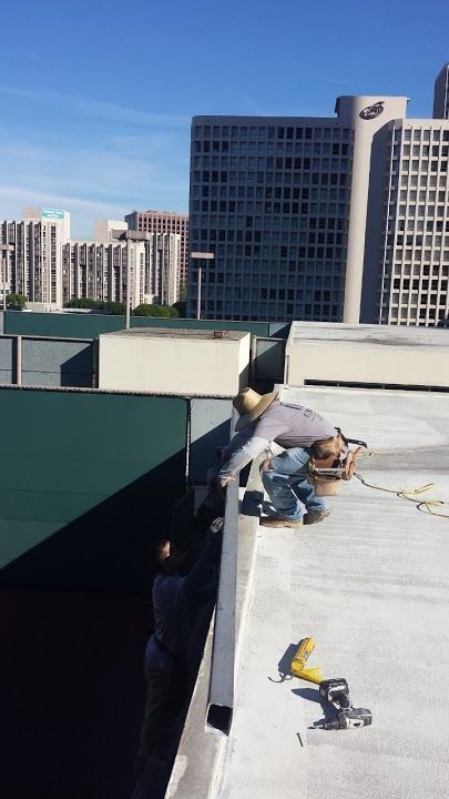 worker installing a gutter