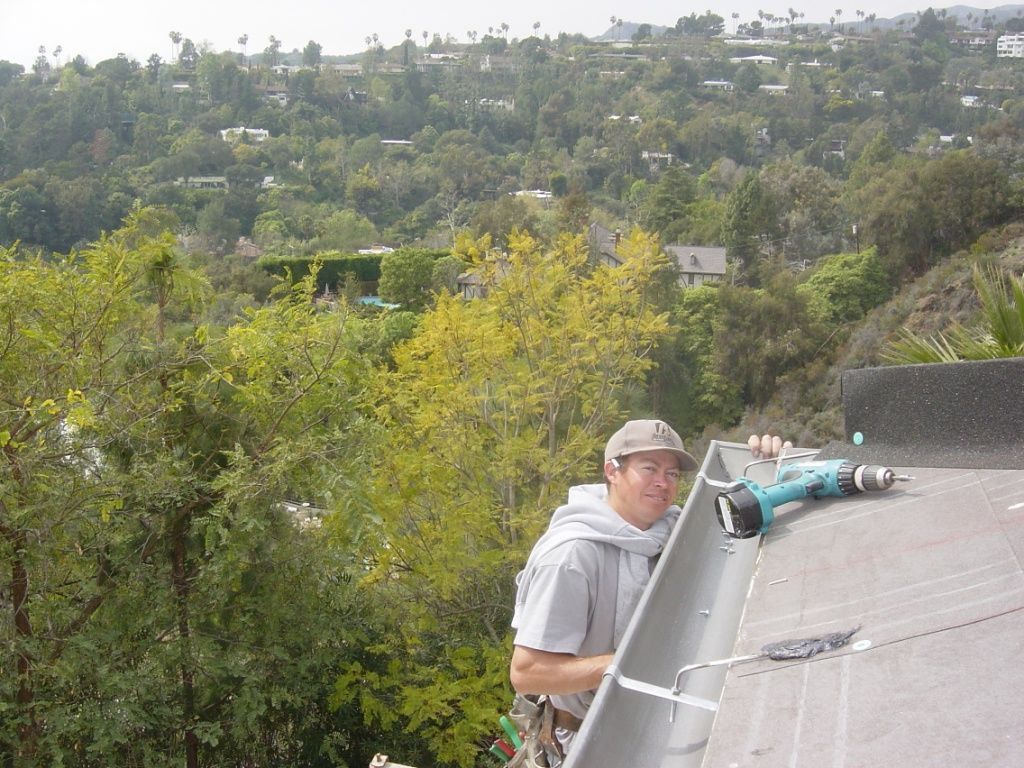 worker installing a gutter