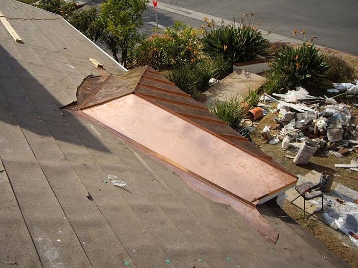 Copper-clad section of a roof under construction; showing the installation of the copper sheathing.