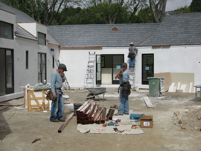 construction workers installing a roof 