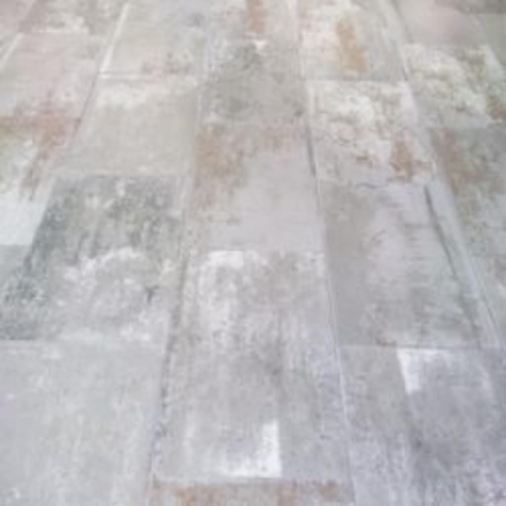 A close up of a tiled floor in a room.