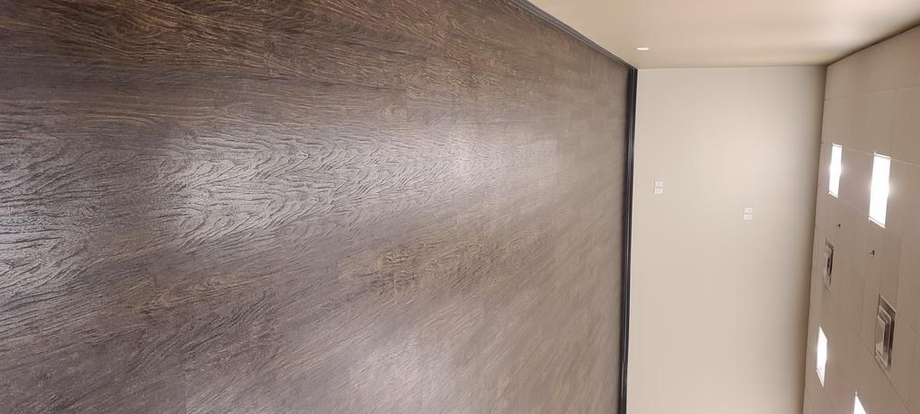 There is a large wall in the middle of the room.