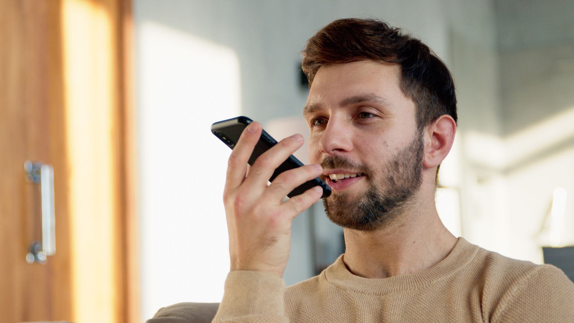 A woman is holding another woman 's hand while sitting down.