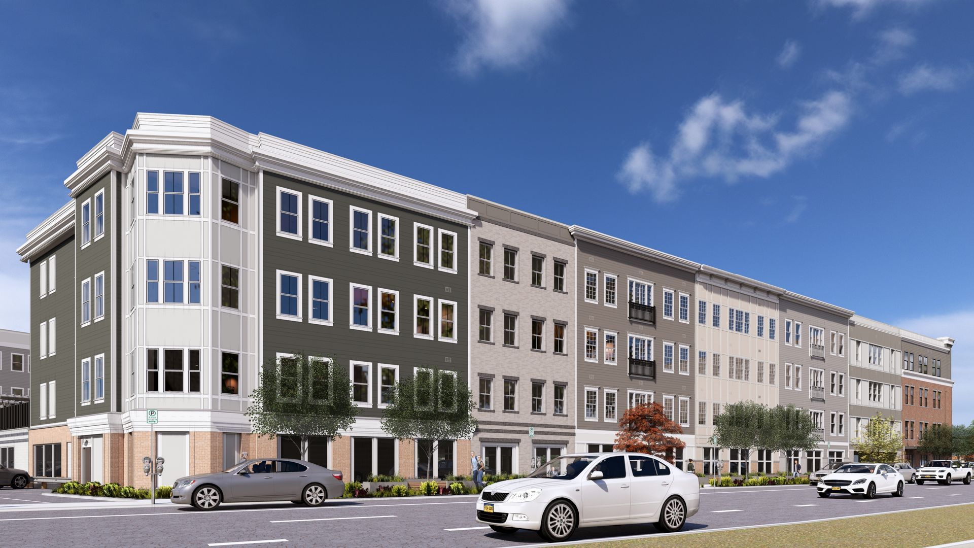 Multi-story apartment building with street-level retail, cars driving, and blue sky.