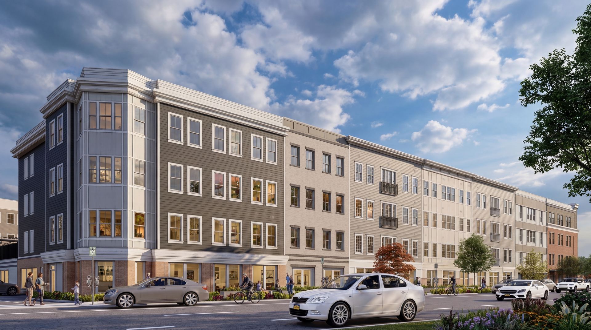 A multi-story apartment building with retail on the ground floor, featuring dark and light siding, under a cloudy sky.