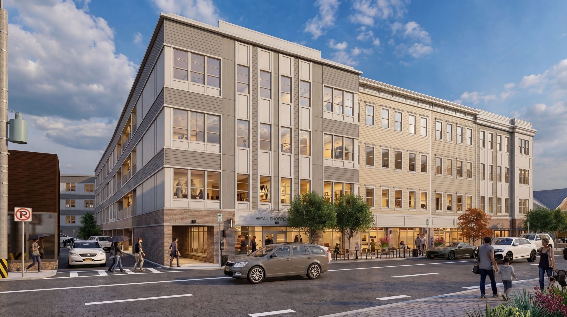 A modern, multi-story apartment building with grey and beige facade, street-level retail, cars, and pedestrians.
