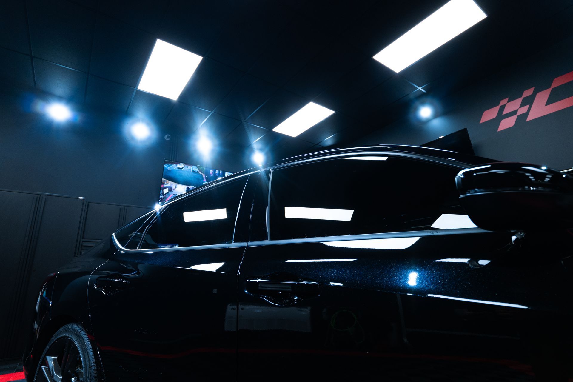 Close‑up of ceramic window tint on a car window in Cornelius, NC showing glare and heat reduction.