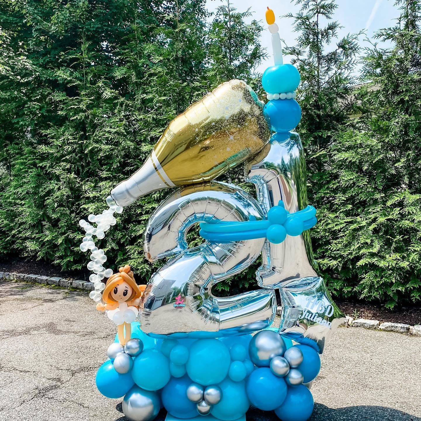 a bunch of balloons are stacked on top of each other