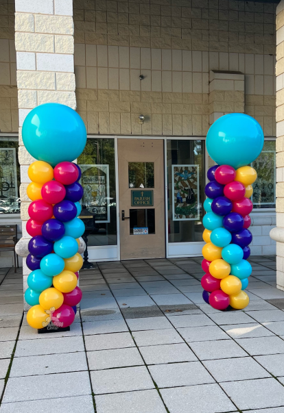 three columns of blue and yellow balloons with astronauts on them