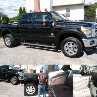 A black pickup truck is parked in a parking lot.