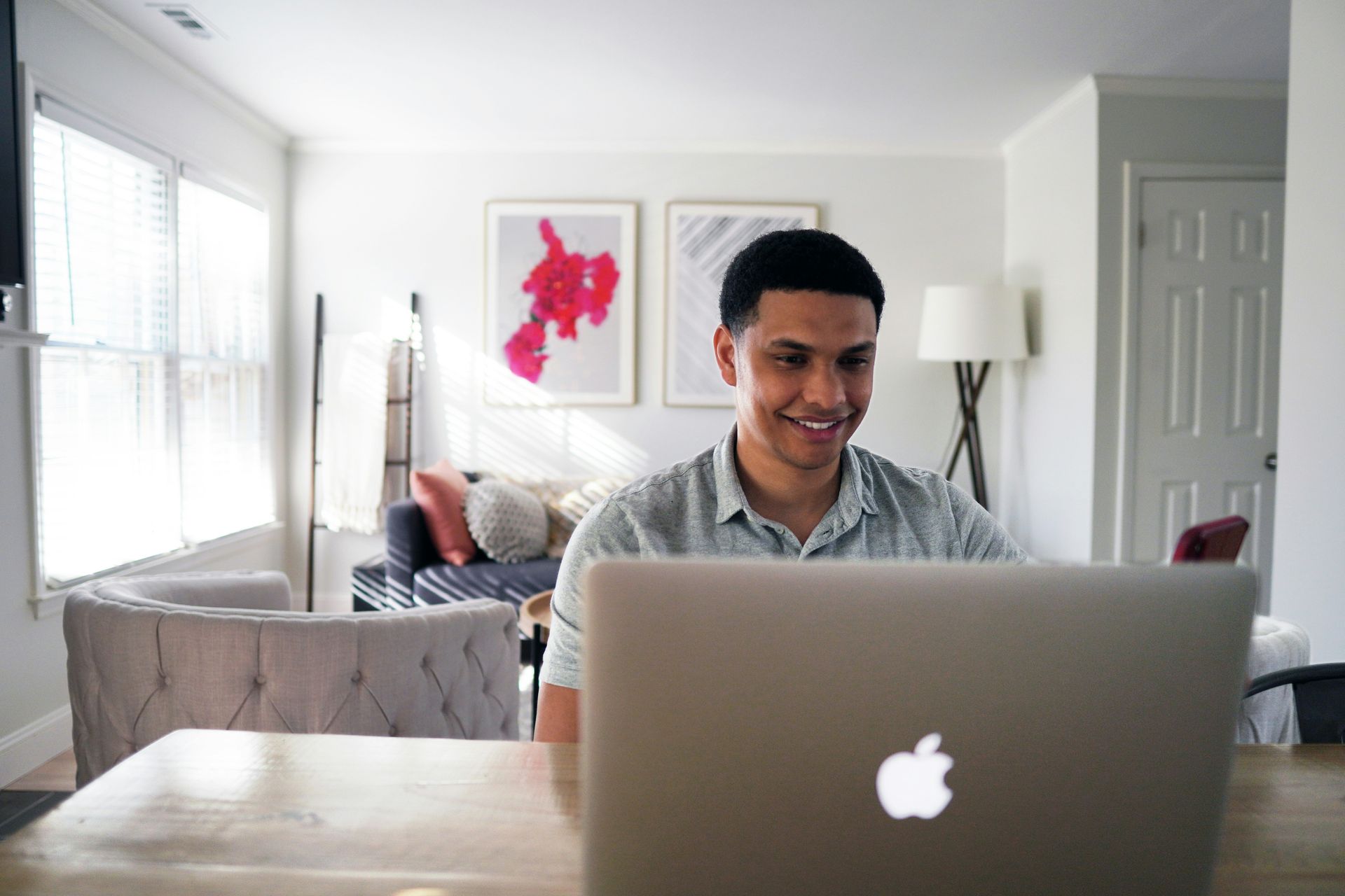 A person is typing on a laptop computer.