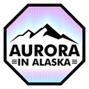 The logo for aurora in alaska is a stop sign with a mountain in the background.
