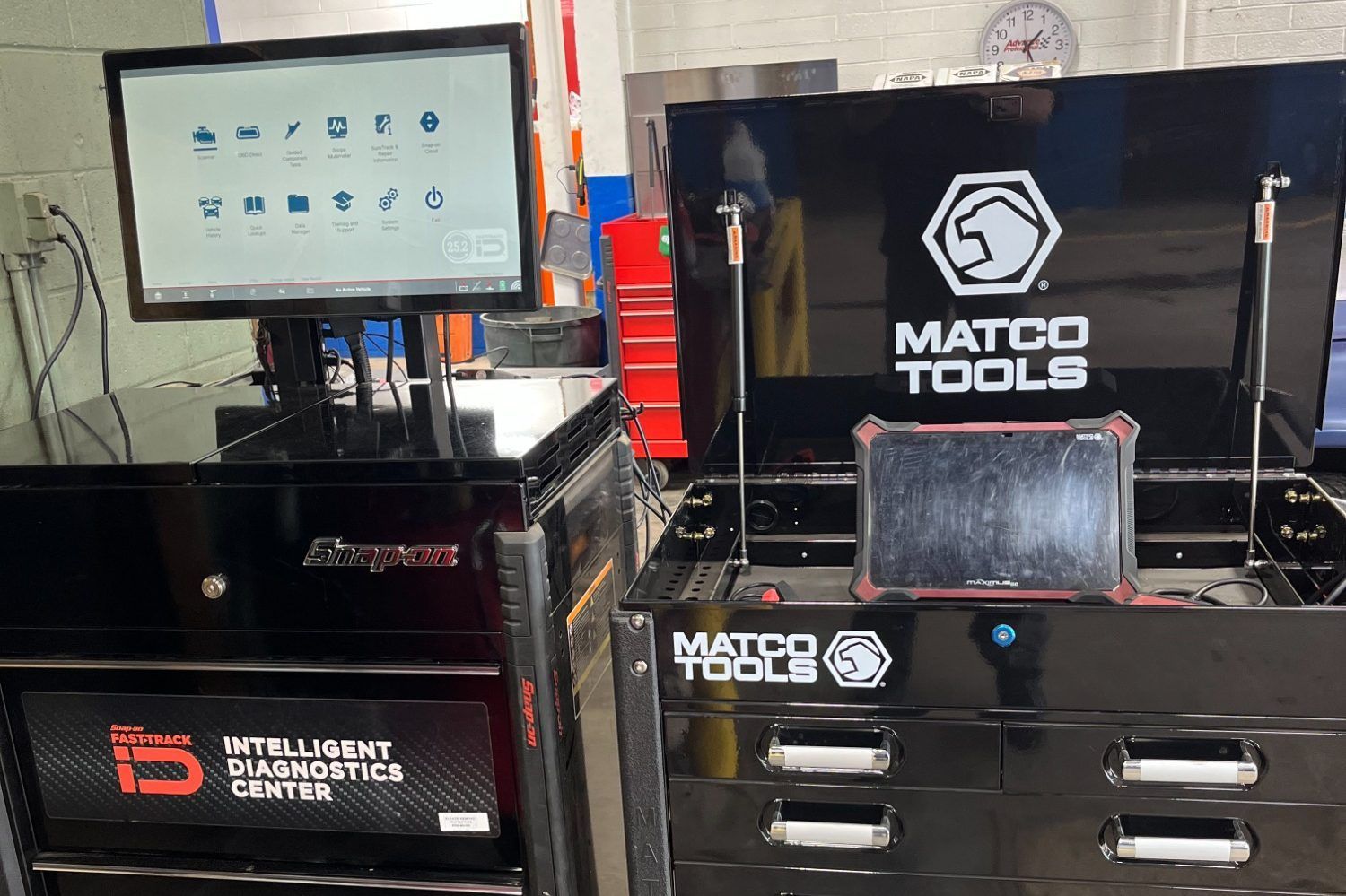 Two black tool chests with diagnostic equipment: monitor, tablet, and Matco Tools logo in a garage | Diamond Automotive