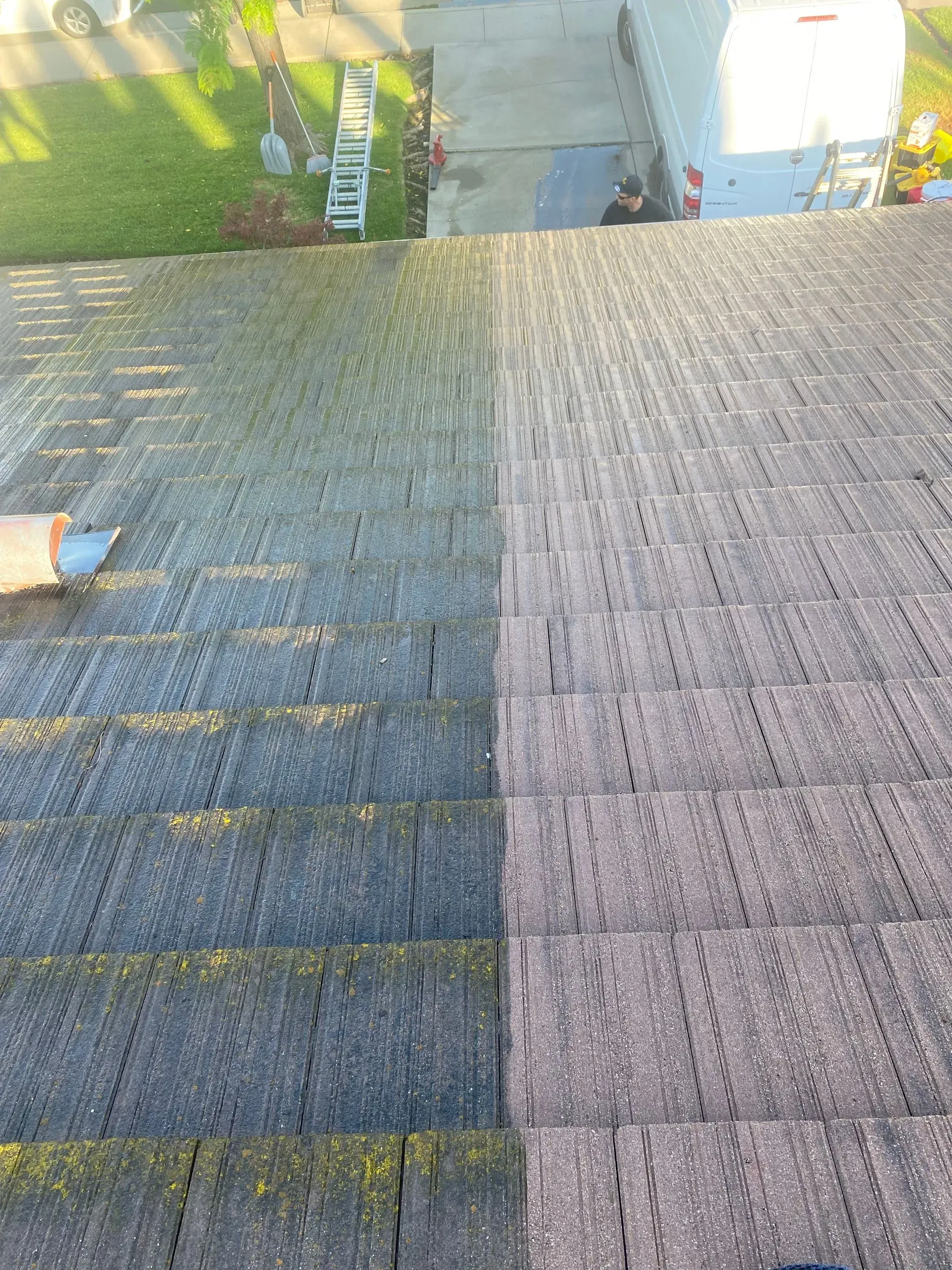 A picture of a roof before and after being cleaned.