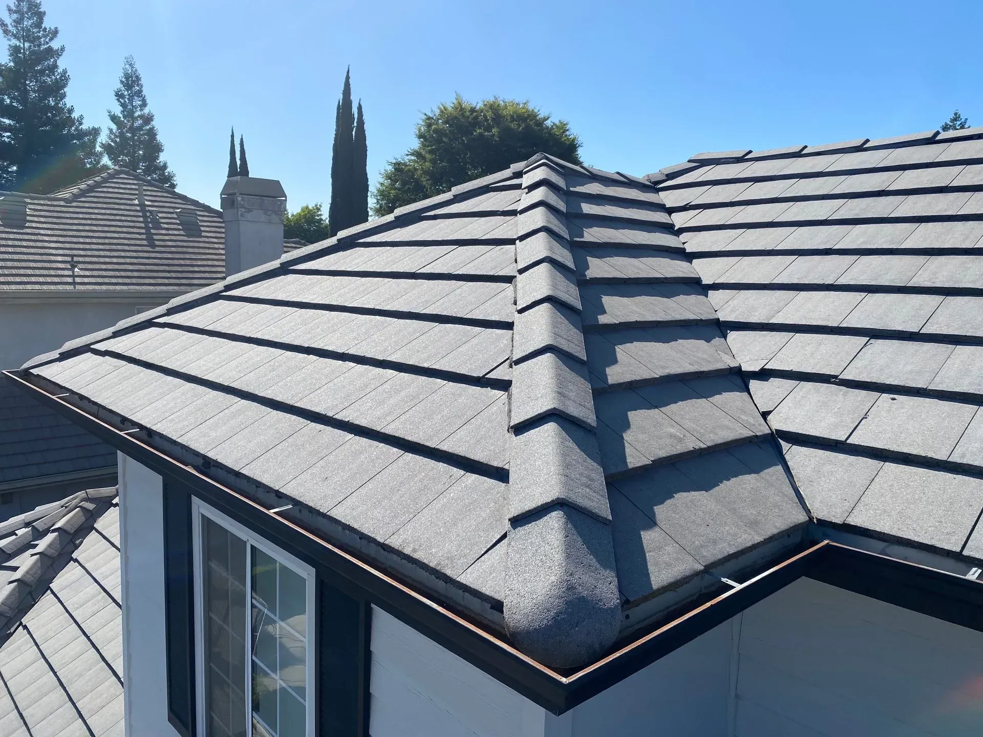 A house with a tiled roof and a window